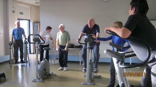 Cardiac Club members exercising on static bicycles